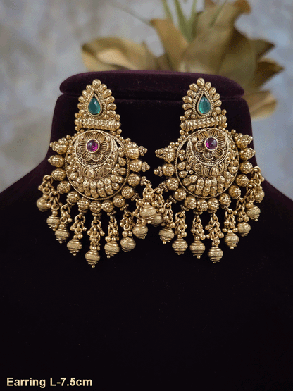 Green tear drop leaf design top with ruby stone flower and flower engraved gold bead design earrings