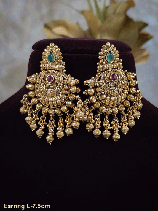 Green tear drop leaf design top with ruby stone flower and flower engraved gold bead design earrings