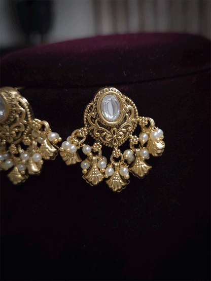Oval kundan traditional design shell design drops earrings