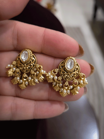 Oval kundan traditional design shell design drops earrings