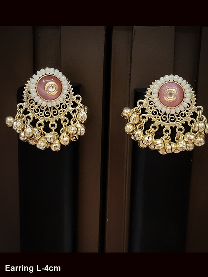 Circular coloured stone pirohi earrings with ghunghru hangings and kundan in middle