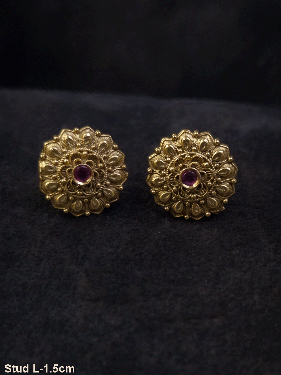 Ruby stone in the center of flower design studs with leaf petal design