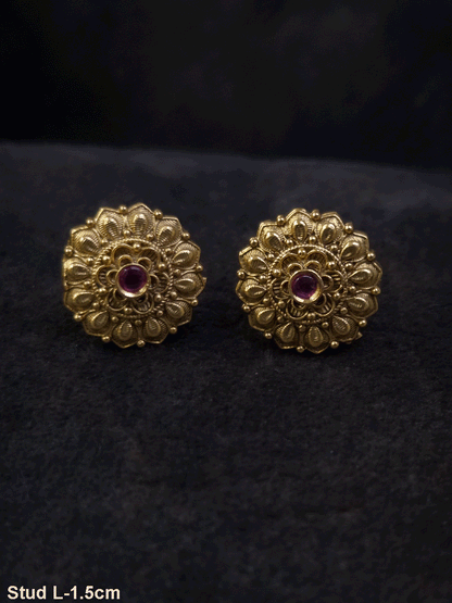 Ruby stone in the center of flower design studs with leaf petal design
