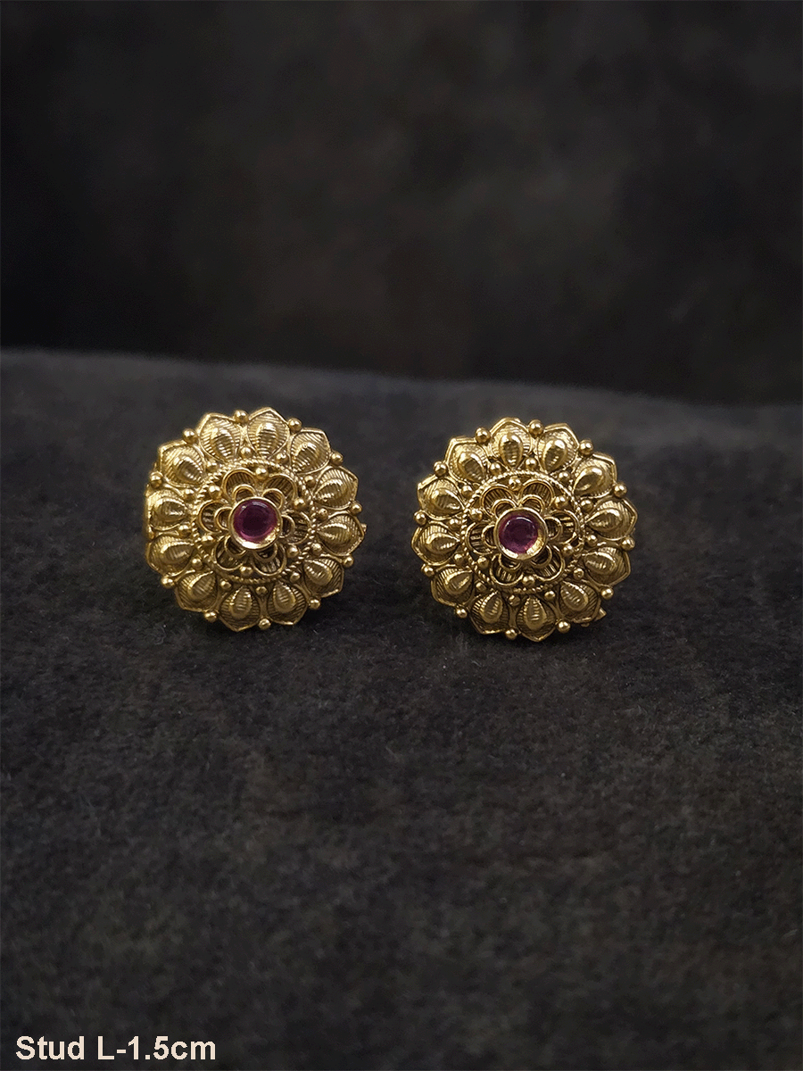 Ruby stone in the center of flower design studs with leaf petal design