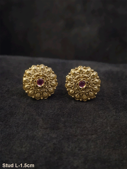 Ruby stone in the center of flower design studs with leaf petal design