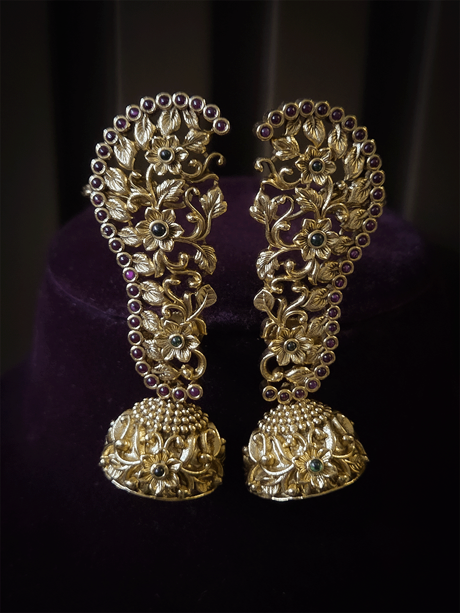 Traditional flowers design with ruby and green stones studded earcuffs