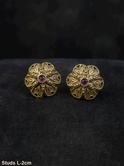 Flower design 2cm broad studs with ruby stone in center