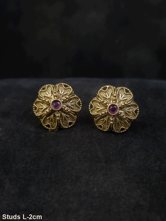 Flower design 2cm broad studs with ruby stone in center