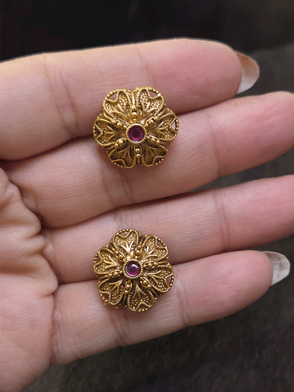 Flower design 2cm broad studs with ruby stone in center
