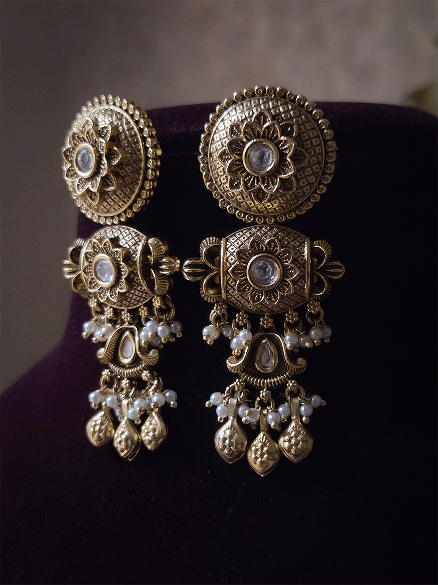 Self design circular top with kundan in flower center earrings with leaf shaped ghunghru