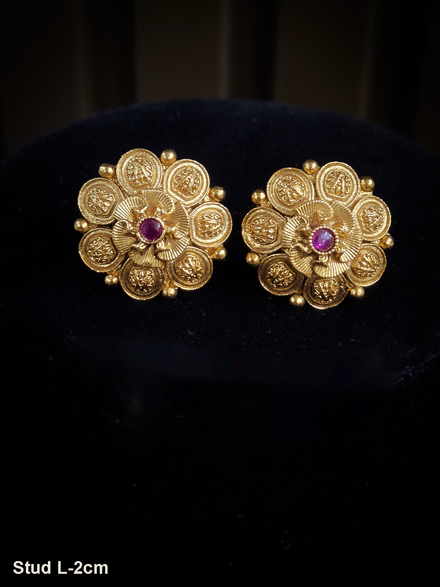 Ruby center stone with flower design center studs