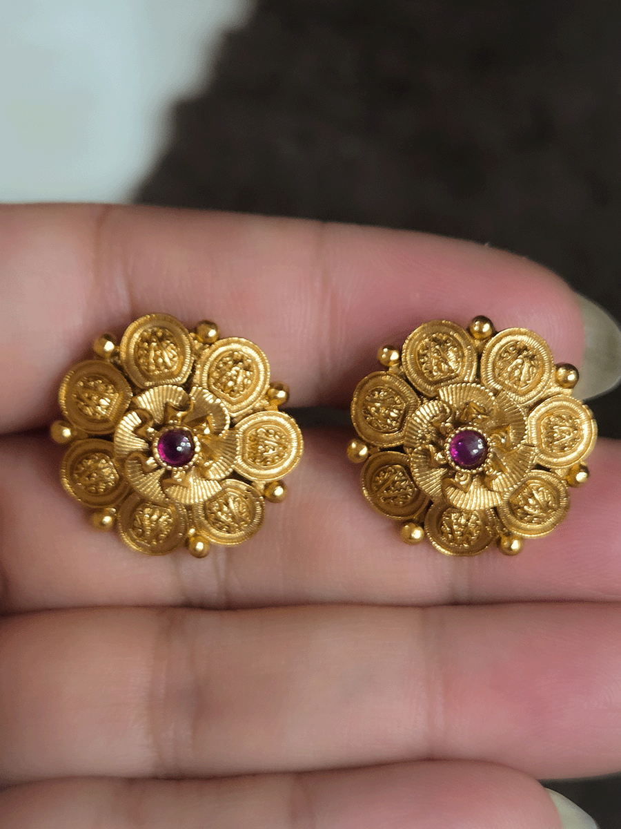 Ruby center stone with flower design center studs