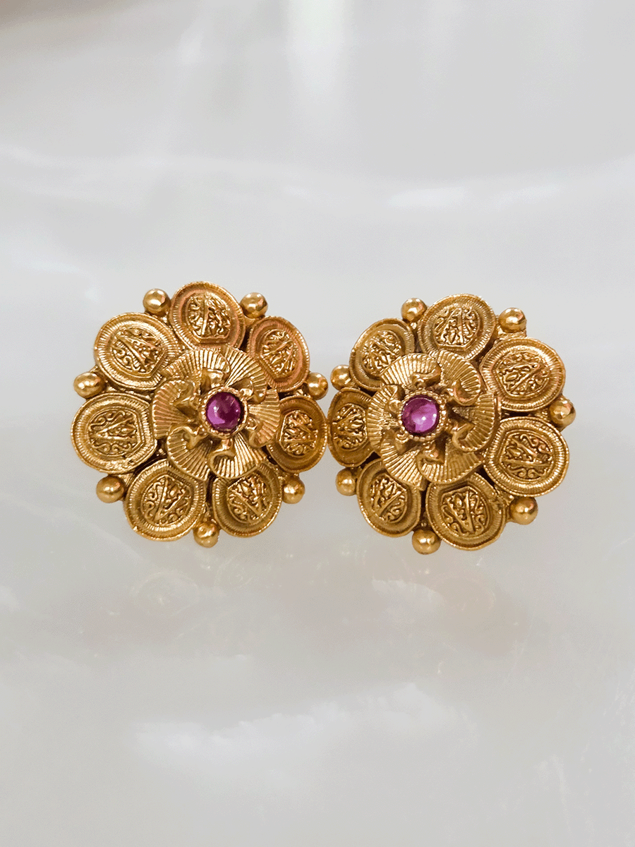 Ruby center stone with flower design center studs