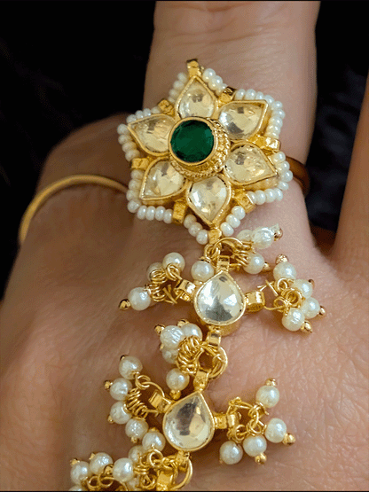 Green stone paachi kundan ring and peacock design tukdi with leaf shaped pearly hanging chain haathphool(single)
