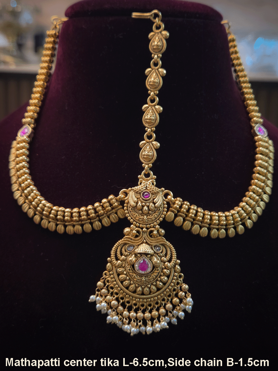 Peacock top with polki and ruby stone center tika mathapatti with leaf design side chains