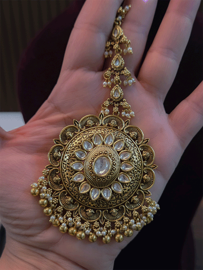 Circular oval center design with oval stone bead hangings maangtika
