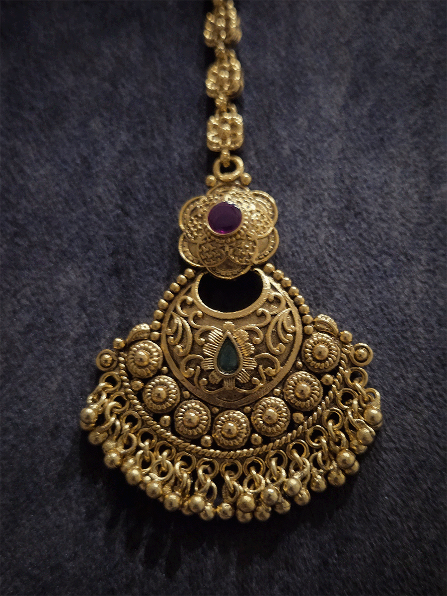 Circular self with gold bead design flower top maangtika with coloured stones
