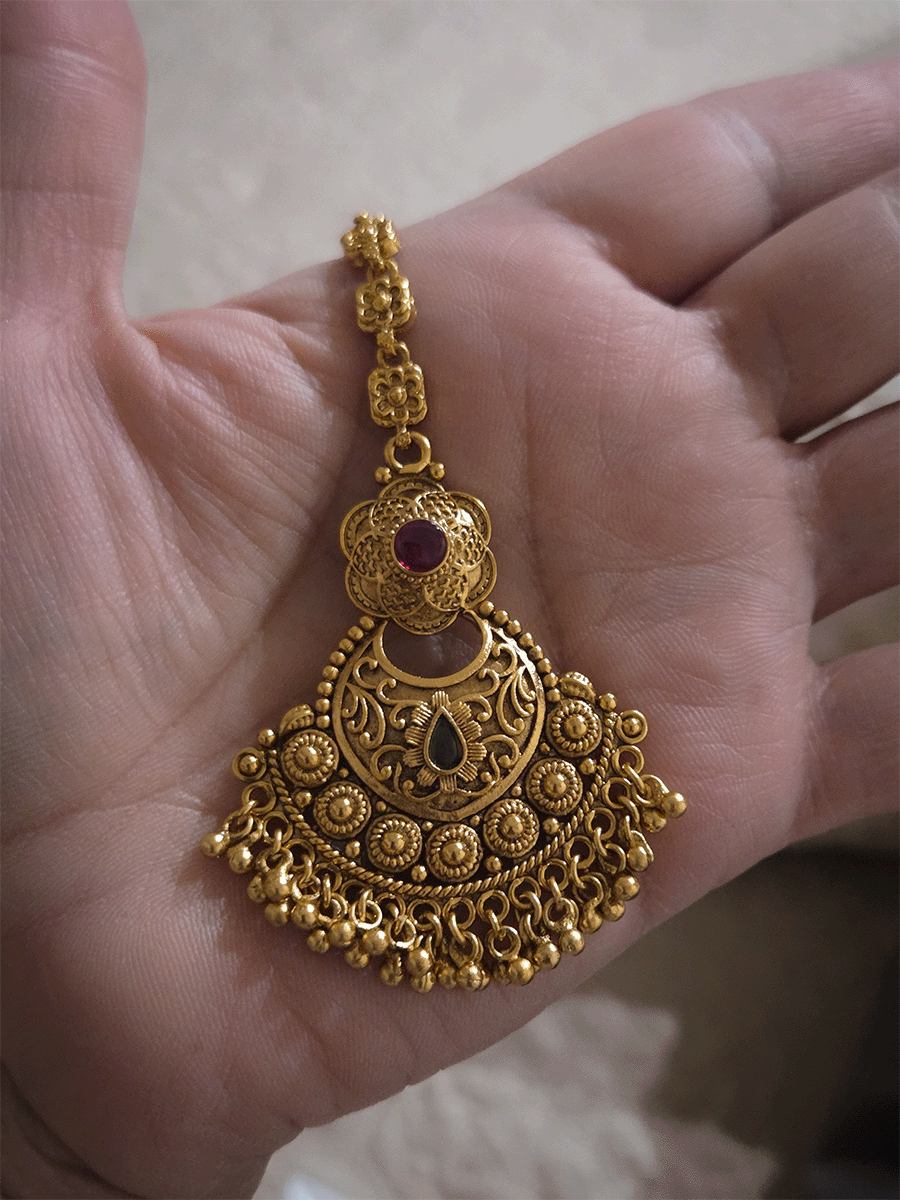 Circular self with gold bead design flower top maangtika with coloured stones