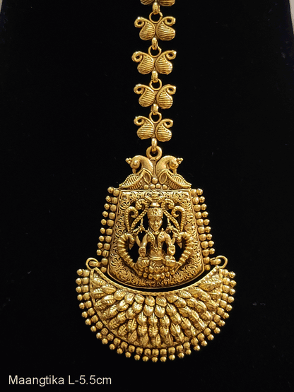 Laxmiji on leaf textured semi circular design paisley design chain maangtika
