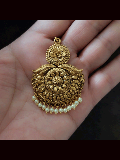 Half flower leaf design detailing maangtika with white bead hanging
