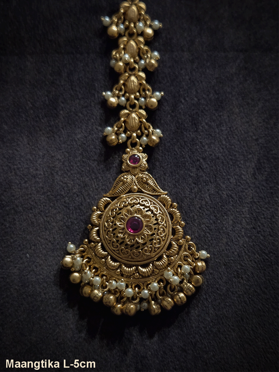 Flower and paisley top with circular flower with ruby stone maangtika