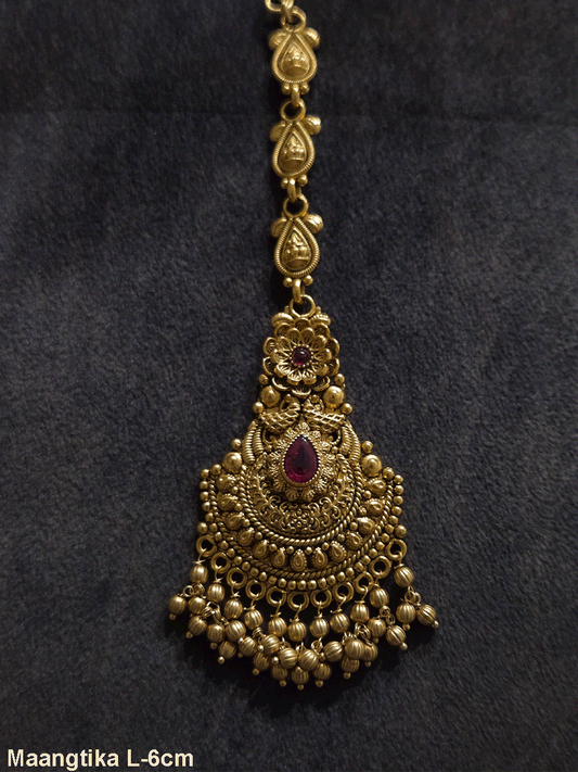 Tear shaped ruby stone center with flower top design maangtika with gold bead hangings