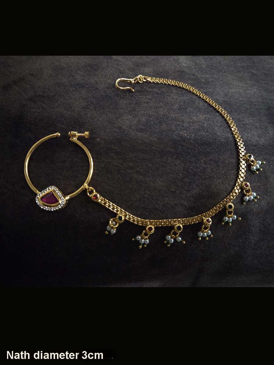 Triangular ruby stone with AD outline 3cm diameter nath