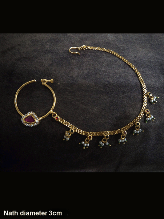 Triangular ruby stone with AD outline 3cm diameter nath