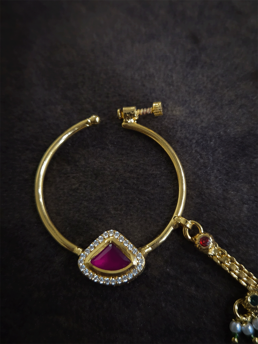 Triangular ruby stone with AD outline 3cm diameter nath