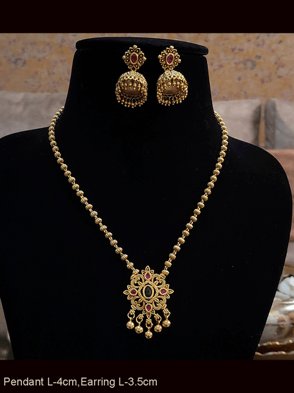 Ruby and green stones studded pendant set in gold bead chain