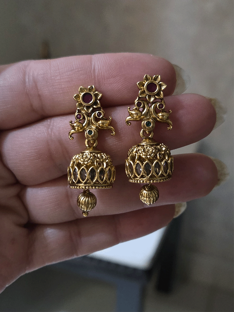 Ruby stone flower center with peacock sides intricate design polki set