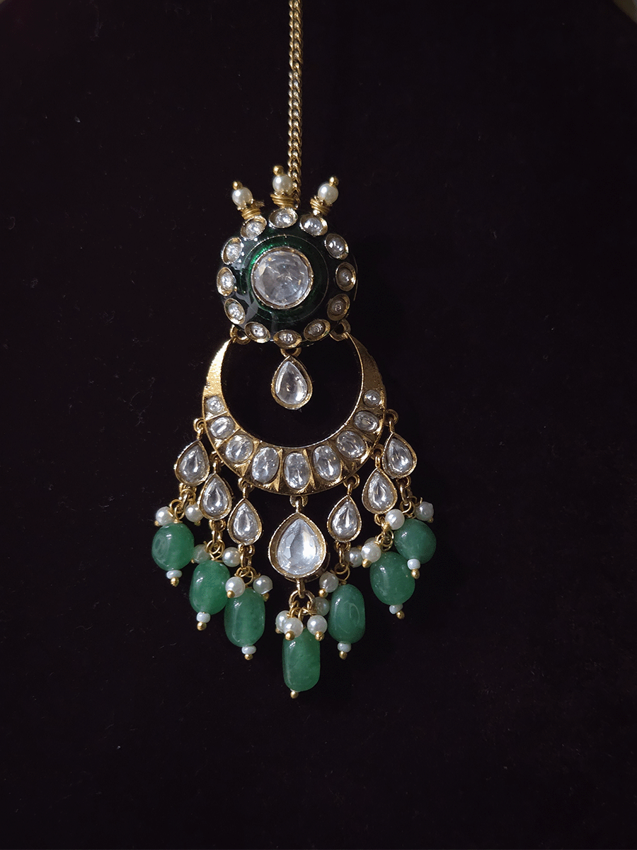 Circular uncut polki set with top bead detailing and green enamel work