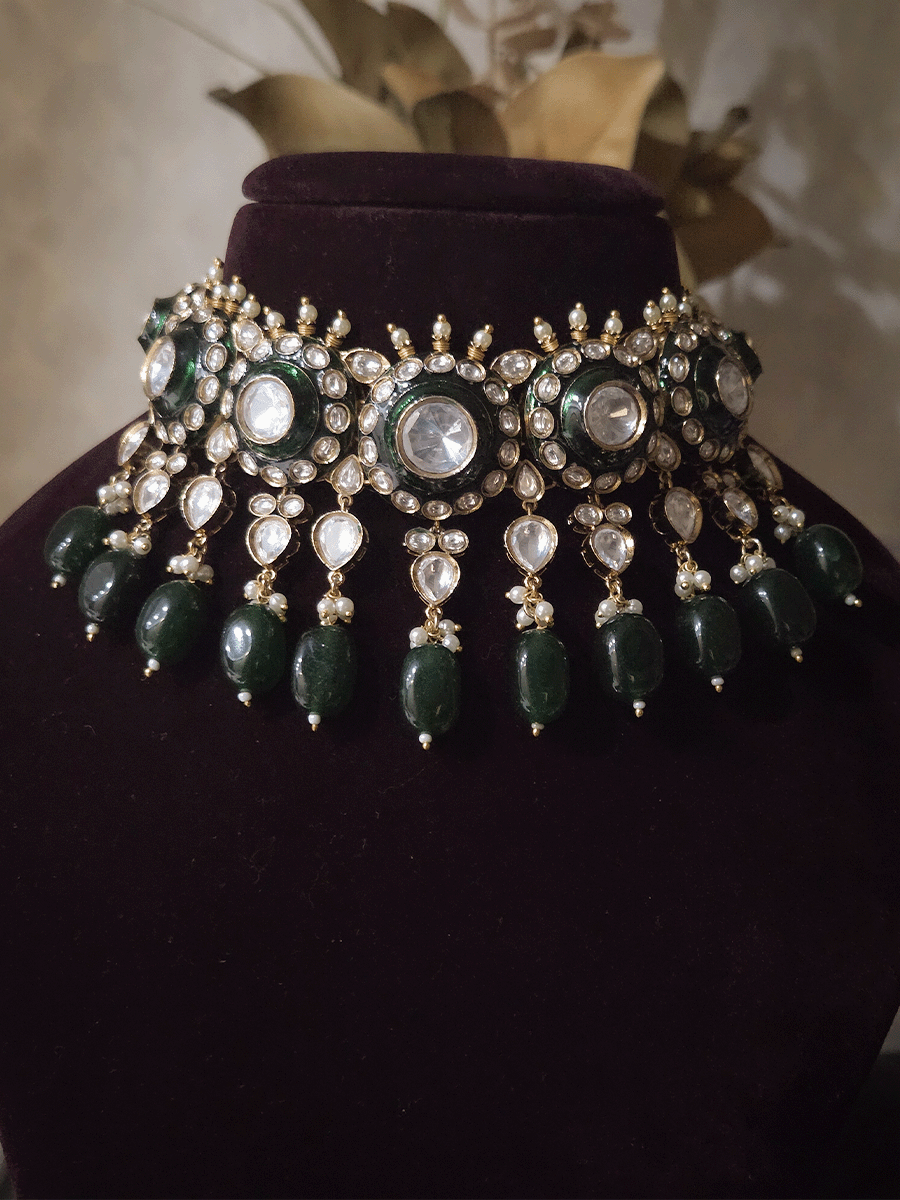 Circular uncut polki set with top bead detailing and green enamel work