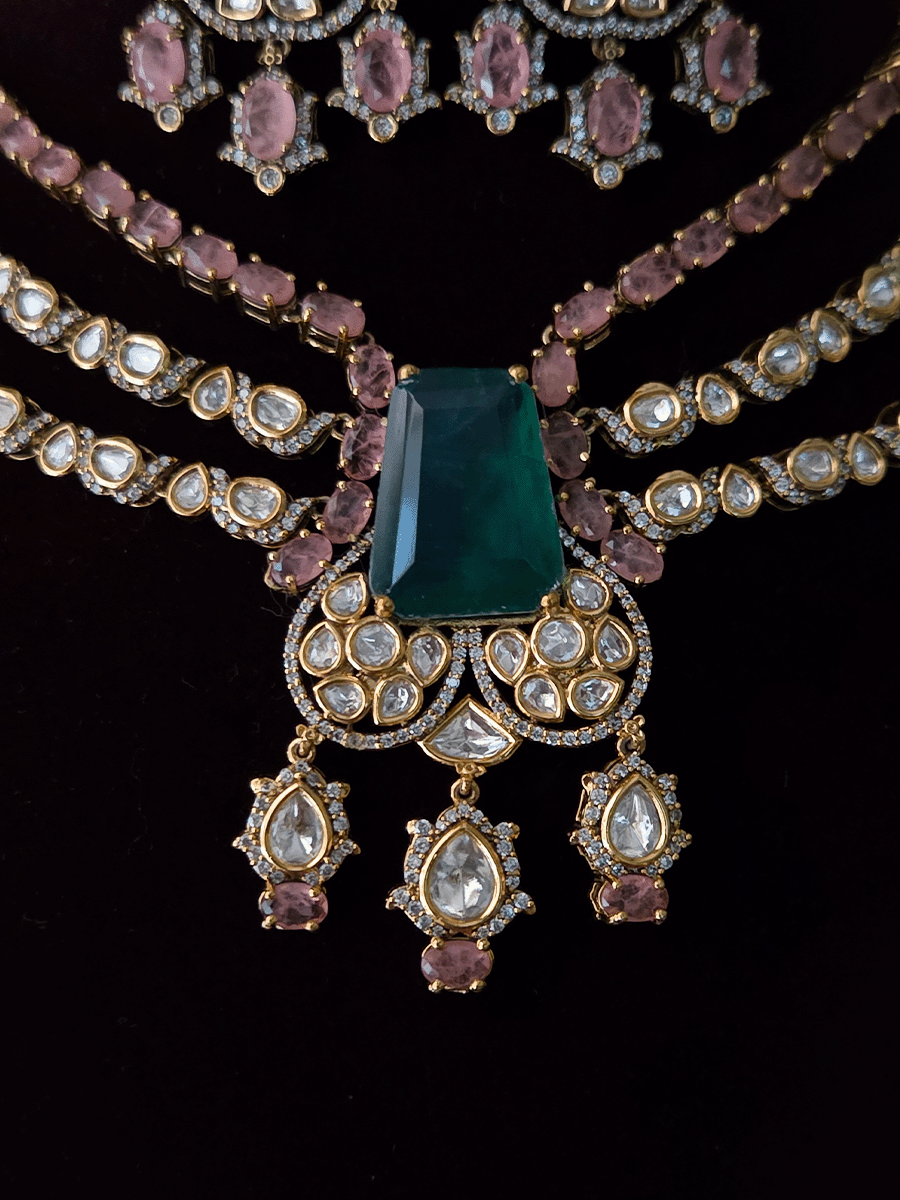 Three layer moissanite set with green stone center and one coloured stone layer
