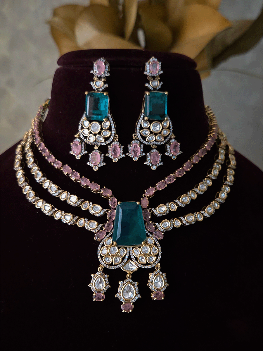 Three layer moissanite set with green stone center and one coloured stone layer