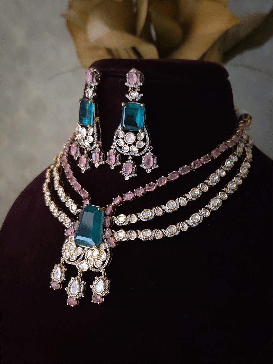 Three layer moissanite set with green stone center and one coloured stone layer