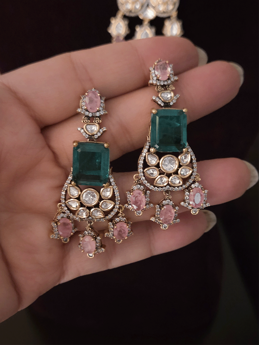 Three layer moissanite set with green stone center and one coloured stone layer