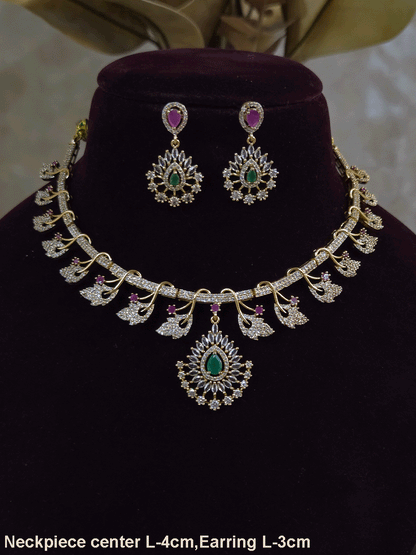 Zircon studded leaf design set with tear drop shaped green stone center hanging tukdi