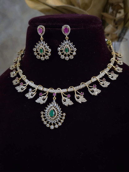 Zircon studded leaf design set with tear drop shaped green stone center hanging tukdi