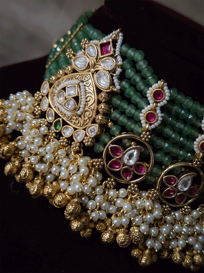 Traditional design kundan tukdies in eight aqua bead strings set