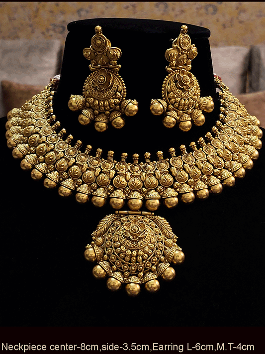Bold gold bead design on classy self design broad necklace set with maangtika