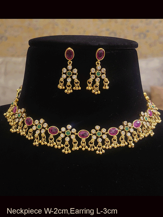Polki flowers with oval ruby stones set with ghunghru hangings