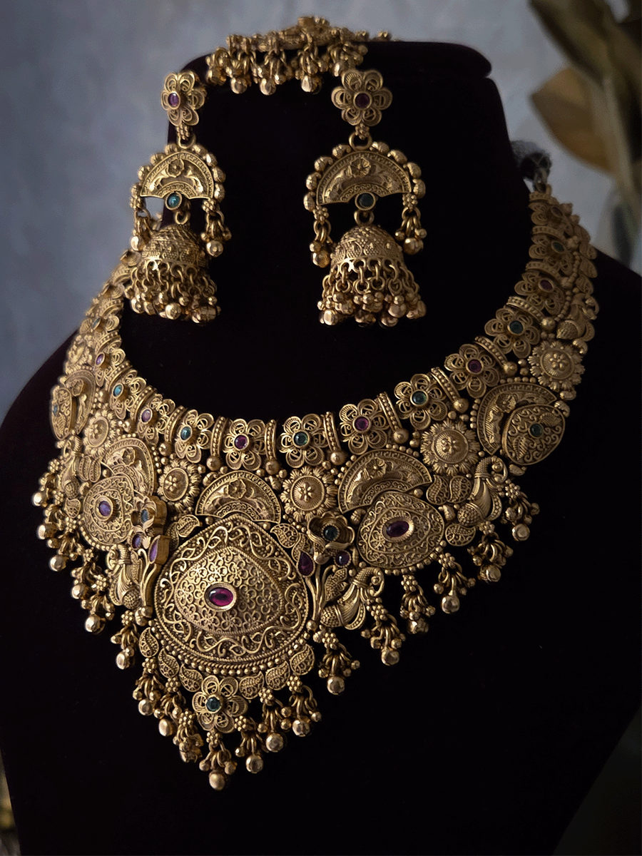 Flowers,paisley and peacock design intricately carved stones studded set