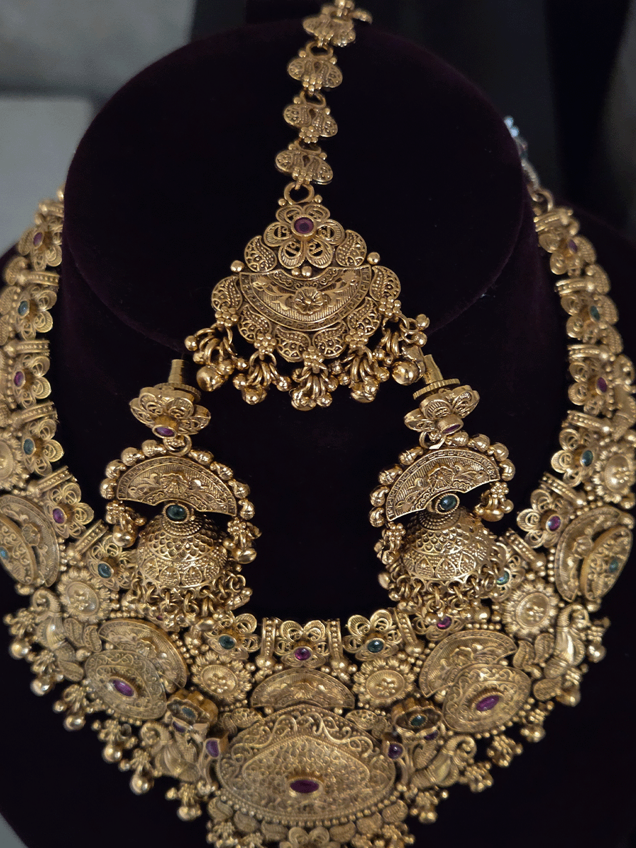 Flowers,paisley and peacock design intricately carved stones studded set