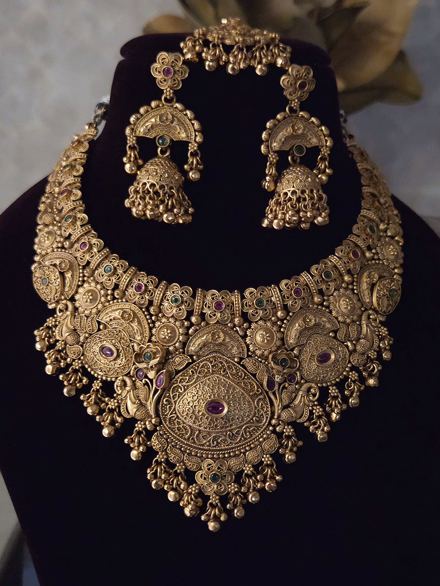 Flowers,paisley and peacock design intricately carved stones studded set