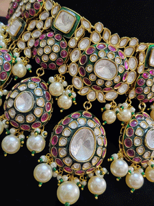 Royal kundan broad choker set with pearl drops and green meenakari work