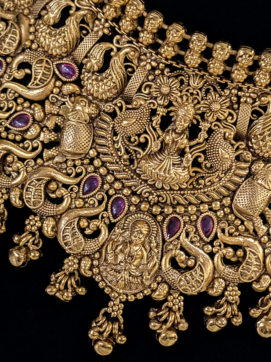 Classy laxmiji motif in center broad choker set with ruby stones and peacock design