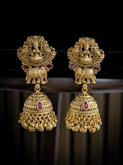 Classy laxmiji motif in center broad choker set with ruby stones and peacock design