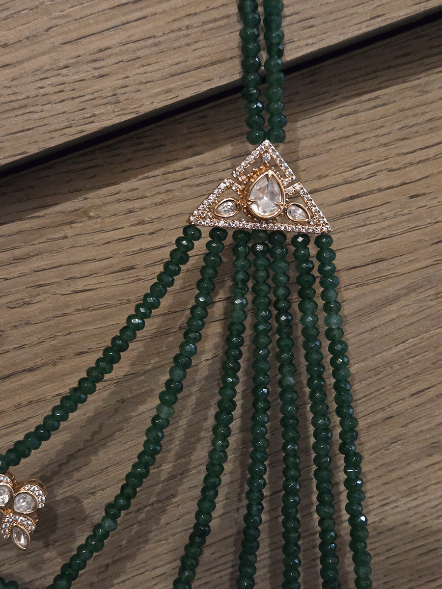 Seven layer onyx beads with half flower moissanite tukdies in center 17 inch long necklace