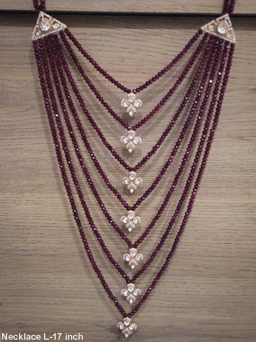 Seven layer onyx beads with half flower moissanite tukdies in center 17 inch long necklace